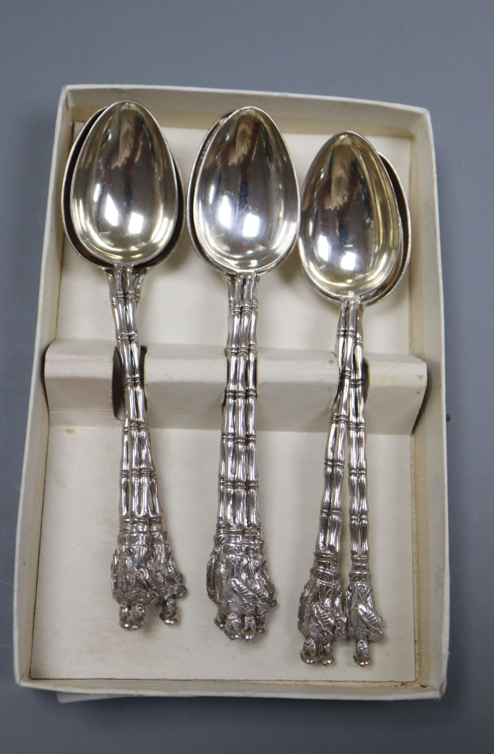 A set of ten Chinese Export white metal teaspoons by Wang Hing, Hong Kong, 5oz.